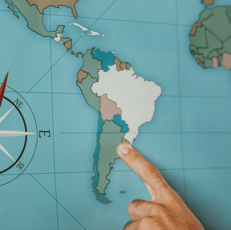 person pointing south america map